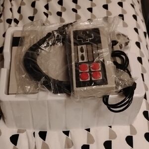 Nintendo Controller with Red and Black Buttons